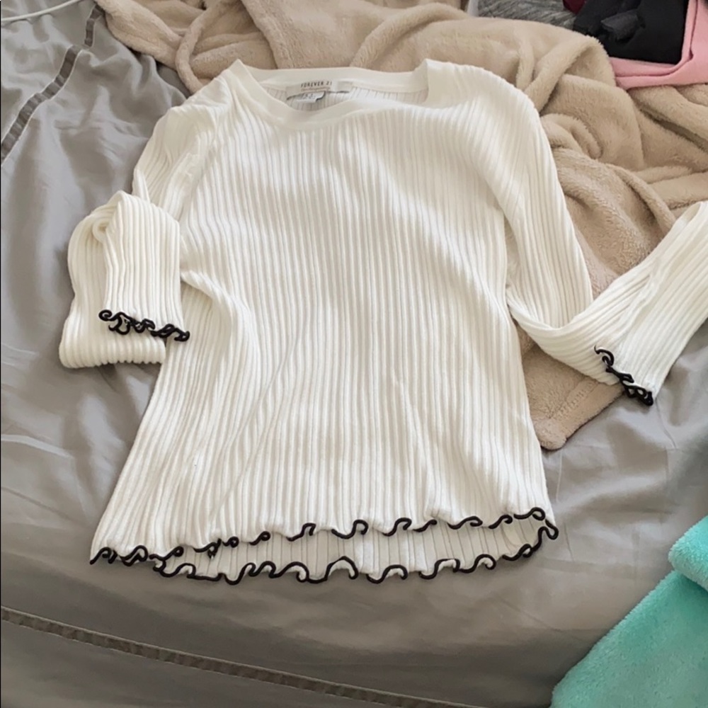 white long sleeve shirt with black ruffles